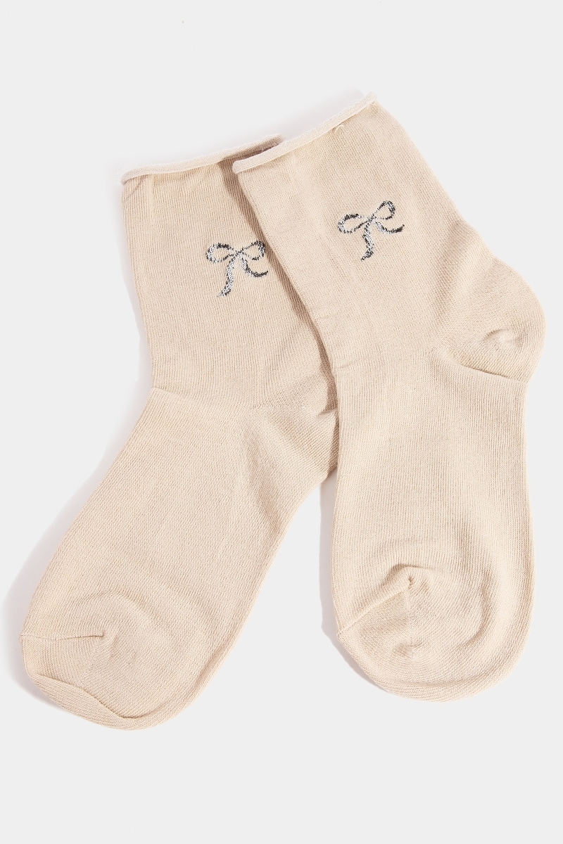 In what ways does polyester enhance the design of the socks?