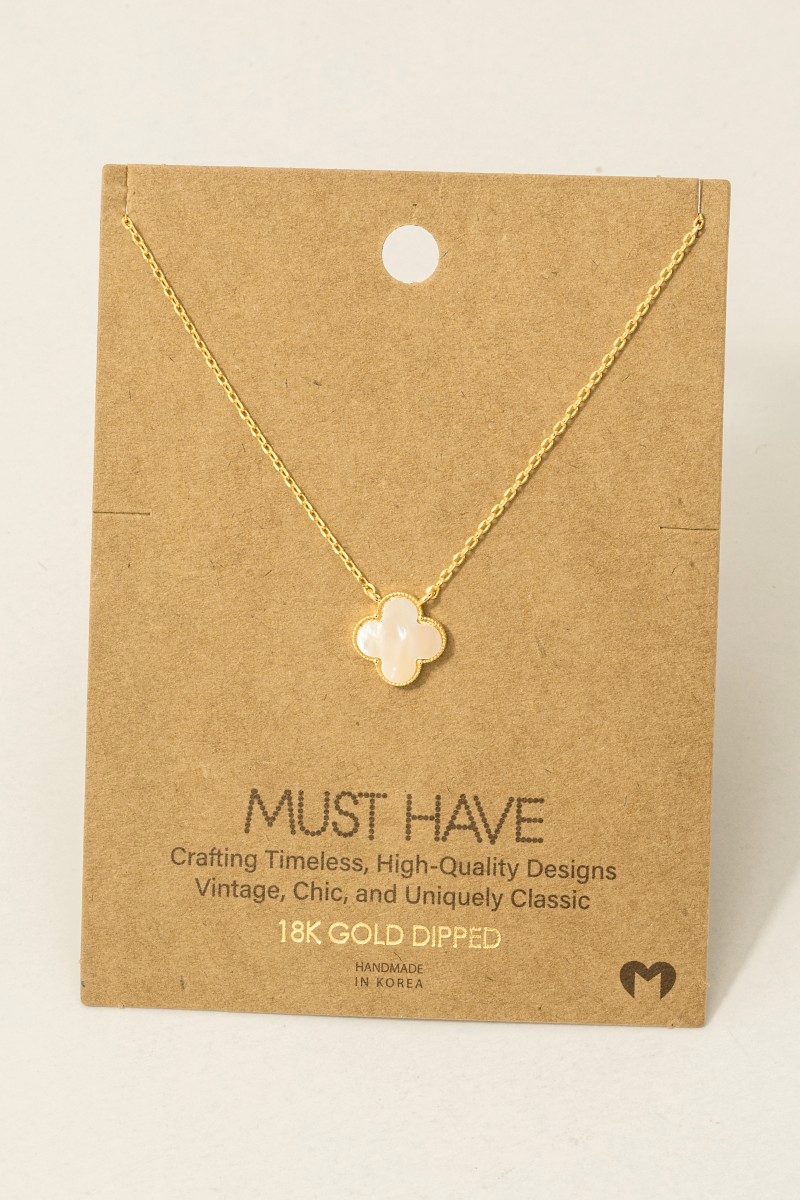 What is the significance of the clover necklace?
