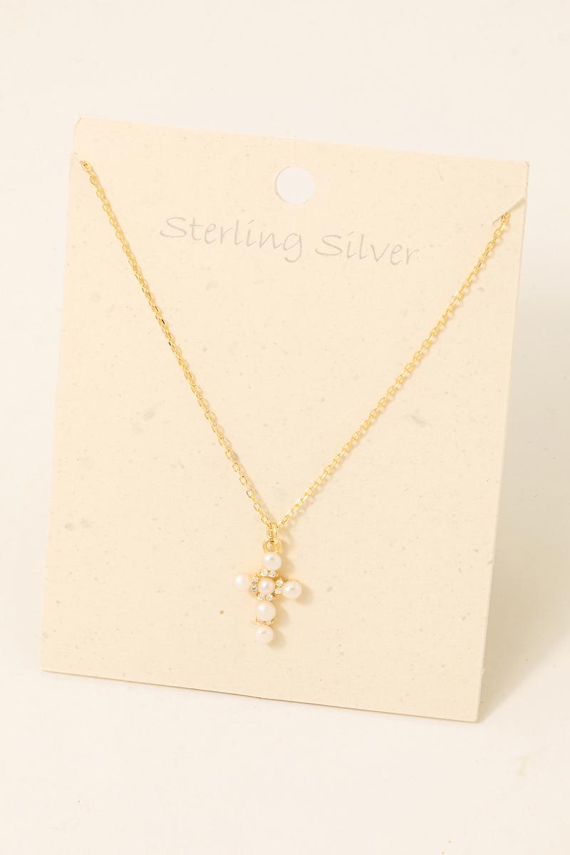 What does the pearl necklace with a cross mean?