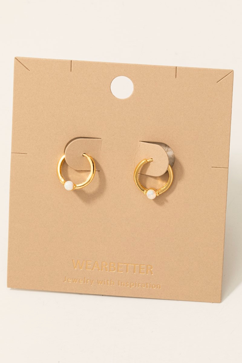 What are the tiny hoop earrings called?