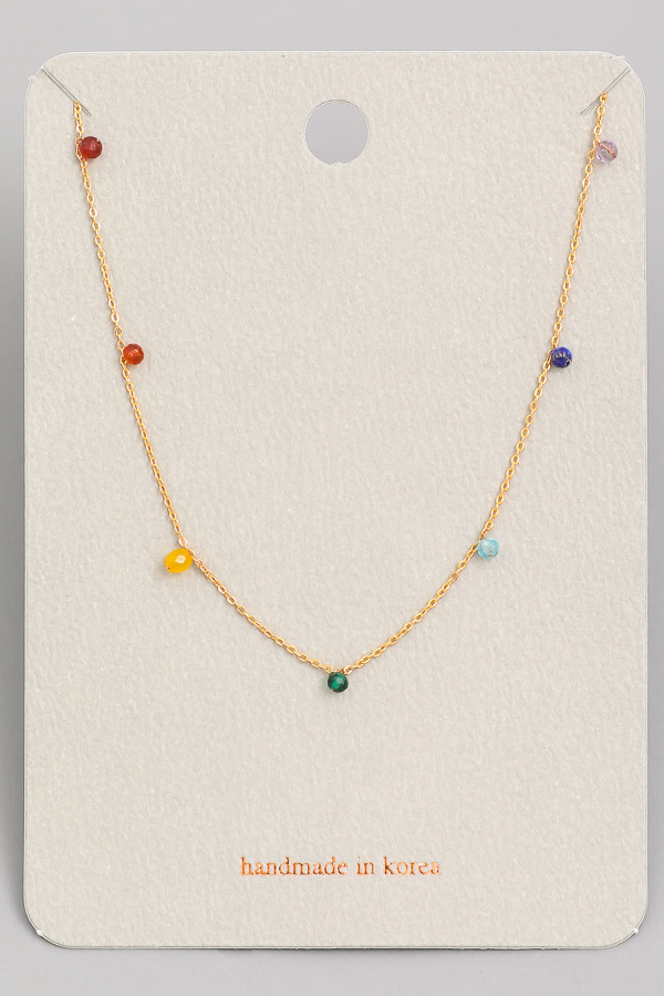 What is the meaning of the beaded necklace?