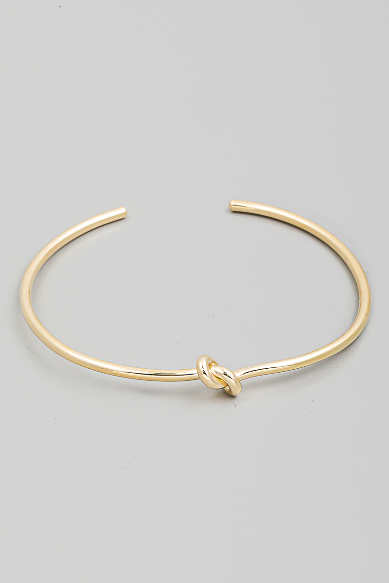 What is the significance of the cuff bracelet?