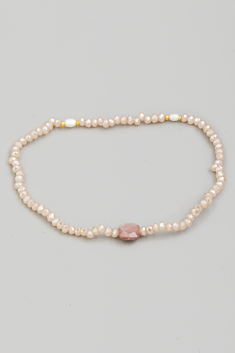What is the significance of the charm bracelet?
